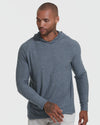Man wearing Heather Navy Active Hoodie and light pants in casual pose.