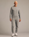 Man in Dark Heather Gray Fleece French Terry Pullover Crew Neck.