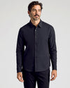 Black Commuter Long Sleeve Shirt on model, showcasing slim fit and modern style.
