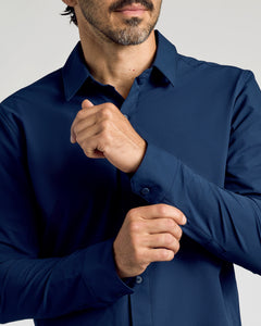 True ClassicMan adjusting cuff of Navy Commuter Long Sleeve Shirt.