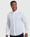 White Lightweight Dress Shirt worn by smiling male model against gray backdrop.