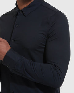 True ClassicMan adjusting cuff of Black Long Sleeve Do-It-All Comfort Shirt.
