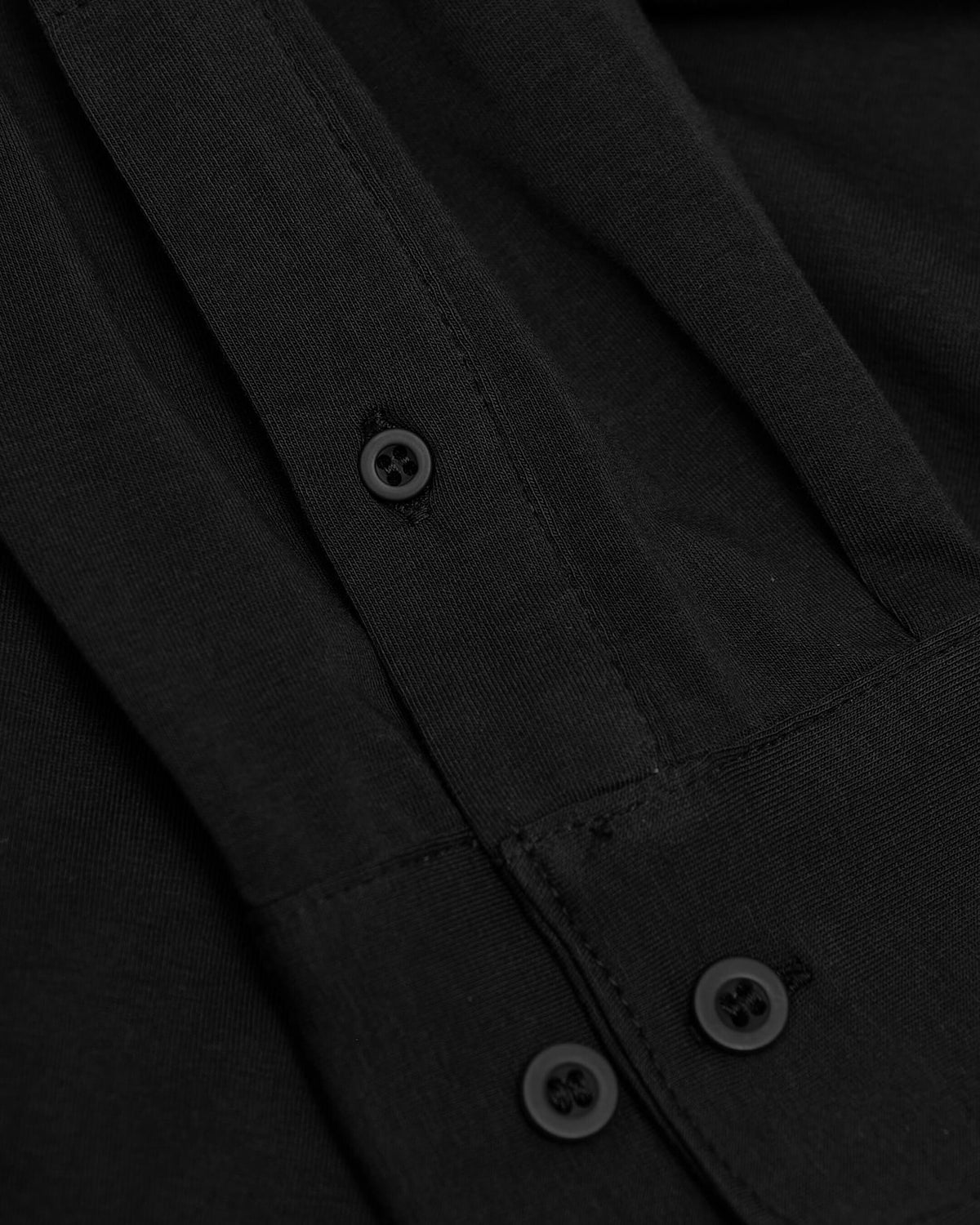Black Long Sleeve Do-It-All Comfort Shirt with textured knit and buttons.