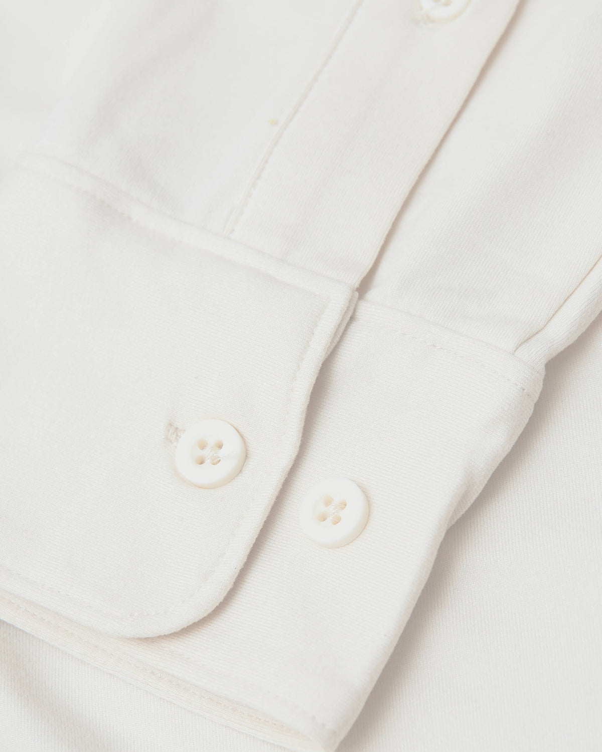 Ecru Long Sleeve Do-It-All Comfort Shirt sleeve with buttoned cuff.