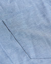 Banker Blue Stretch Oxford Shirt corner with light-blue woven fabric stitching.
