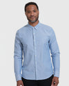 Banker Blue Stretch Oxford Long Sleeve Shirt modeled with dark trousers.