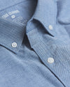 Banker Blue Stretch Oxford Long Sleeve Shirt with buttons and collar detail.