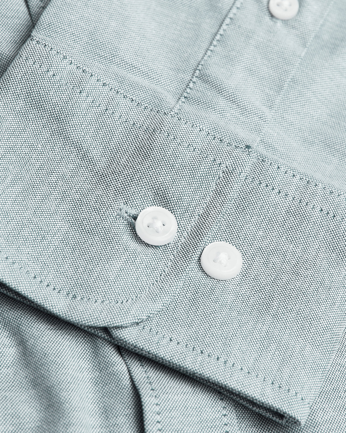 Moss Stretch Oxford Long Sleeve Shirt close-up with buttons and stitching.