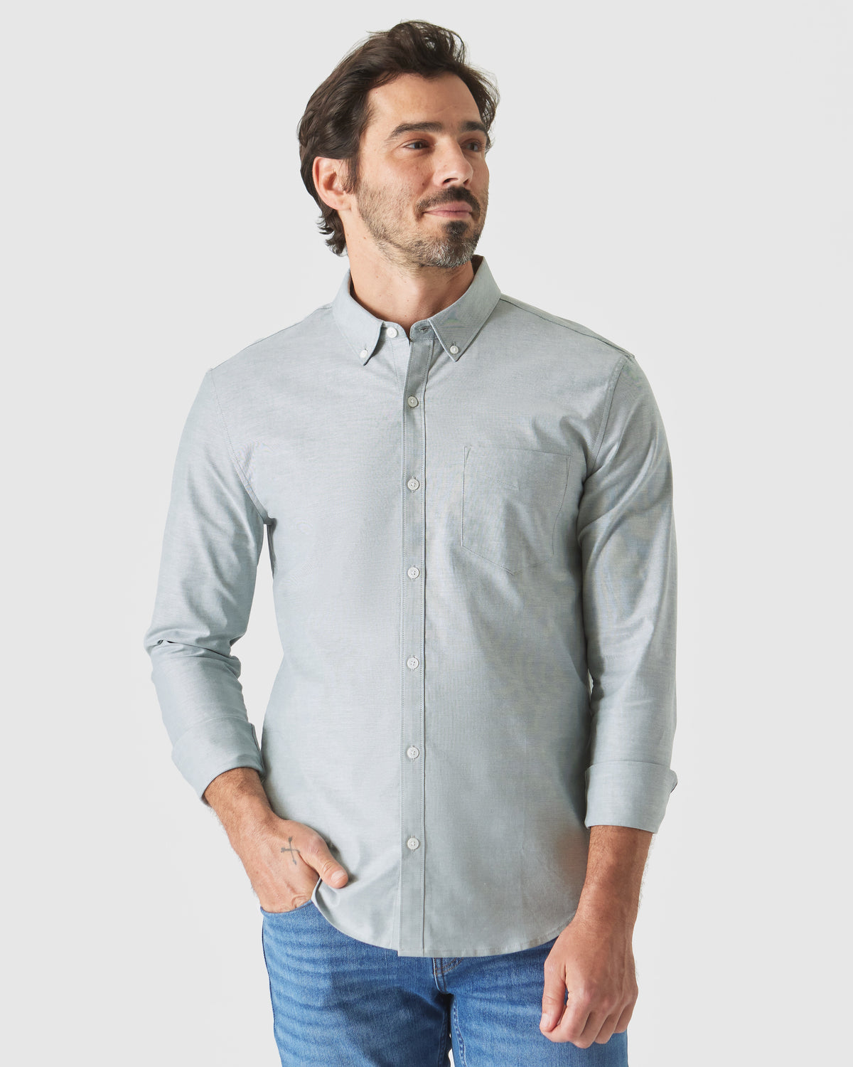 Moss Stretch Oxford Long Sleeve Shirt worn by model in casual pose.