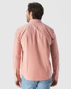 True ClassicMan wearing Peach Long Sleeve Oxford Shirt with jeans, back view.