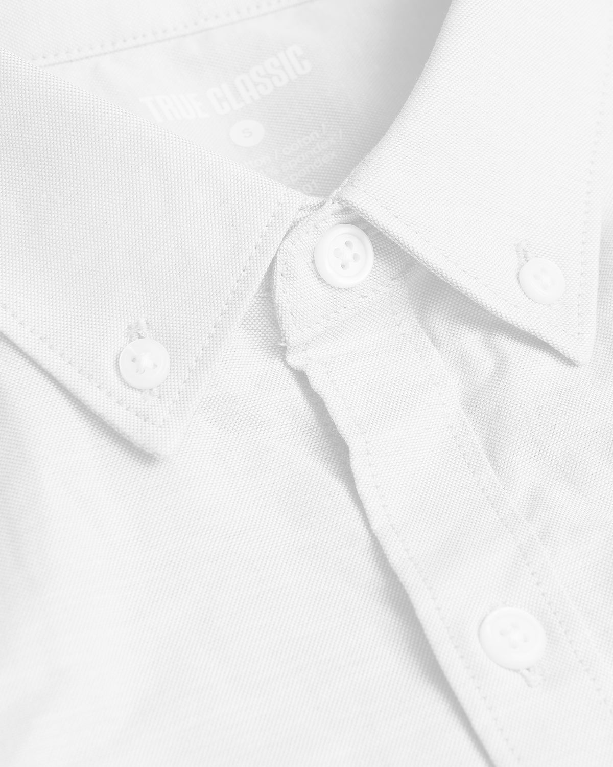 White Stretch Oxford Long Sleeve Button Up Shirt with buttoned collar points.