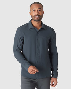 True ClassicMan wearing Heather Navy Long Sleeve Ripstop Commuter Shirt gesturing.
