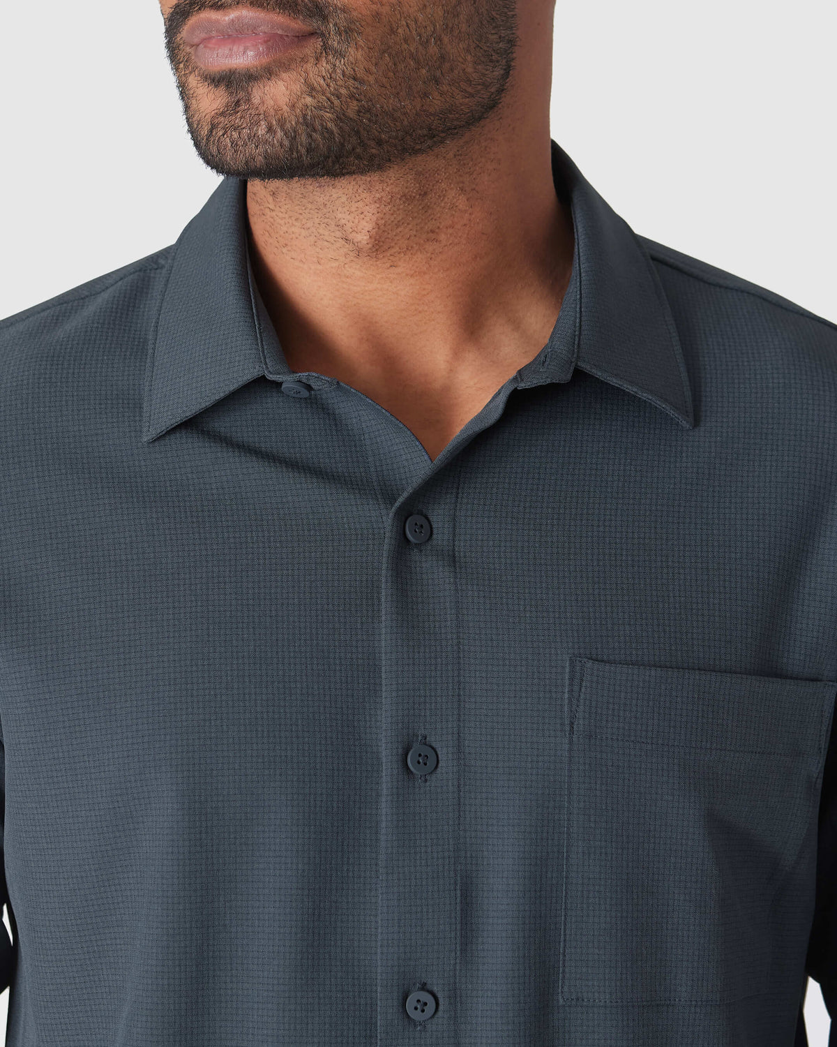 Heather Navy Long Sleeve Ripstop Commuter Shirt with pointed collar and chest pocket.