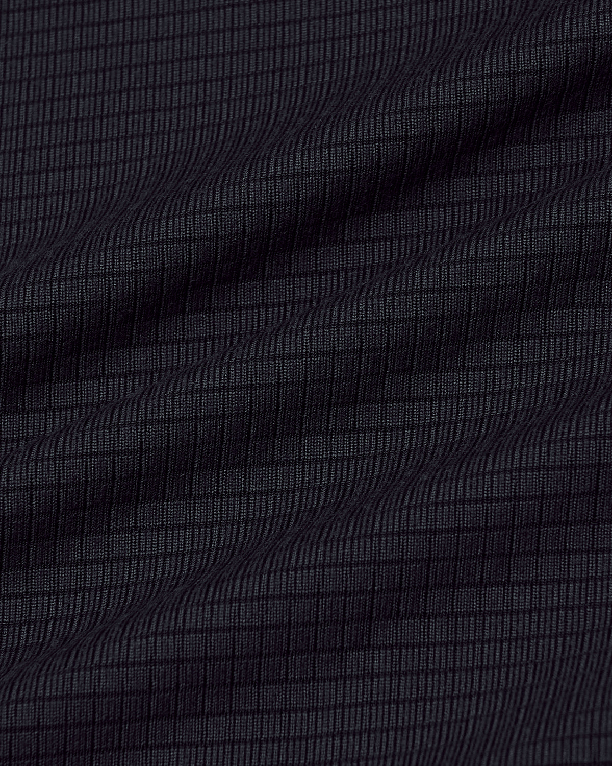 Black Long Sleeve Active Mesh Crew with ripstop texture and gentle fabric folds.