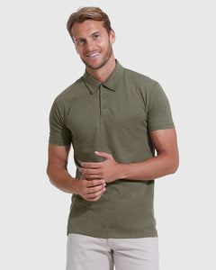 True ClassicHeather Military Green Short Sleeve Tall Polo worn by a smiling man.