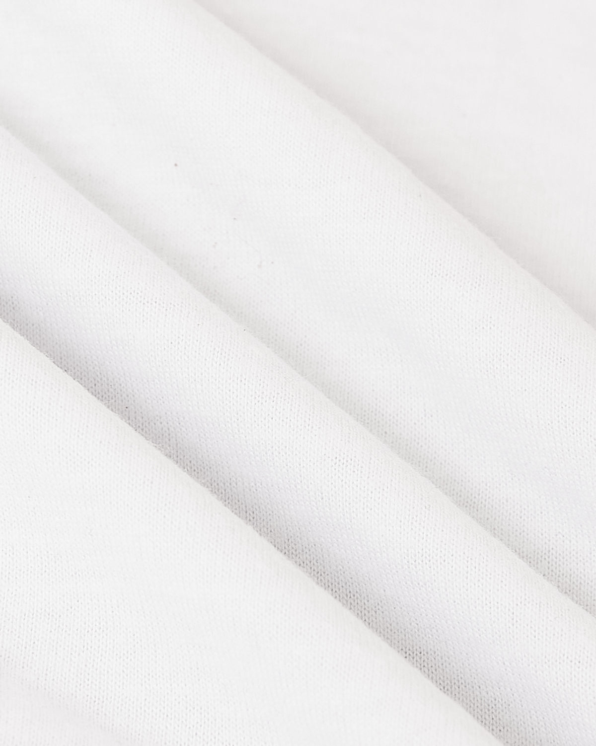 Close-up of All White Tall Classic Polo 3-Pack fabric folds.