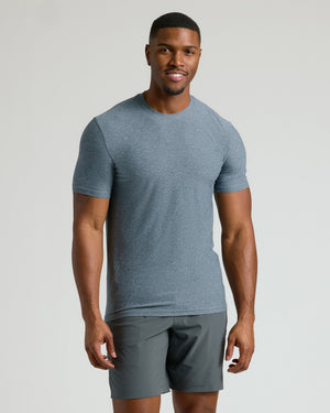 Man wearing Heather Navy Tall Active Crew Neck 2.0 and athletic shorts.