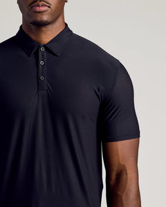 True ClassicBlack Short Sleeve Tall Active Polo with three-button placket, worn by a model.