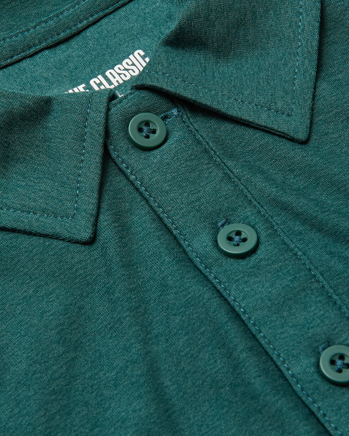 Clover Short Sleeve Tall Active Polo, close-up of collar and buttons.