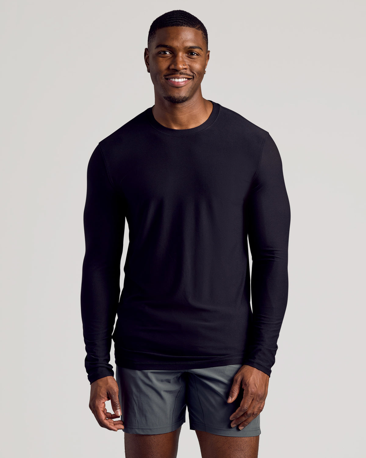 Black Long Sleeve Tall Active Crew on fit man, emphasizing athletic comfort.