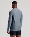 Man in Heather Navy Long Sleeve Tall Active Crew and black athletic shorts.