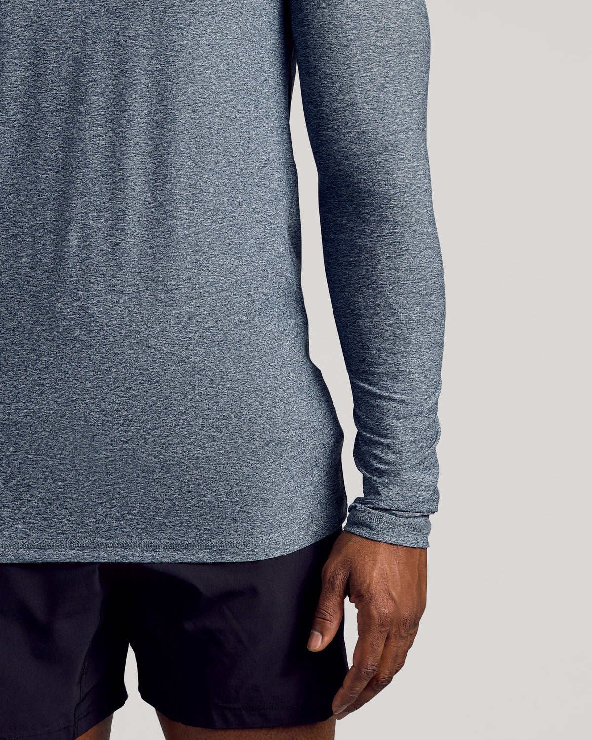 Heather Navy Long Sleeve Tall Active Crew on person’s torso and arm.