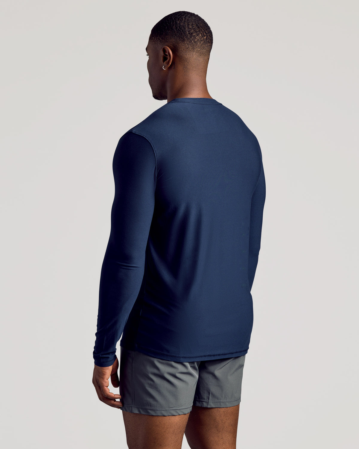 Navy Long Sleeve Tall Active Crew worn with gray workout shorts.