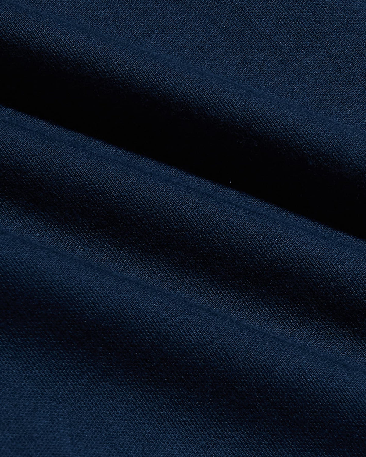 Close-up of smooth navy fabric texture showcasing the soft, durable material used in the Navy Tall Pima Cotton Blend Crew, a men's basics essential.