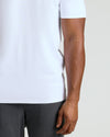 Close-up of a man wearing a white Tall Pima Cotton Blend Crew 4-Pack shirt paired with dark pants, showcasing the smooth fabric and classic fit of this men's basic.