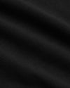 Close-up of Black Tall Dressy Polo's textured fabric with gentle ripples.