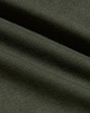 Close-up of soft dark green fabric texture from the Grove Tall Pima Cotton Blend Curved Hem Crew, showcasing quality men's basics material with a smooth, comfortable finish.