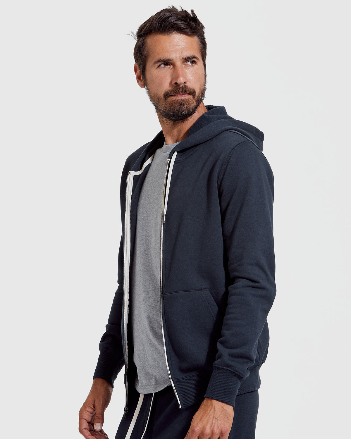 Man wearing Navy Fleece French Terry Zip Hoodie.