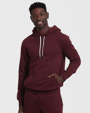 Man in Mahogany Fleece French Terry Pullover Hoodie smiling.