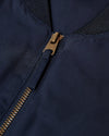 Navy Bomber Jacket with brass zipper and ribbed collar.