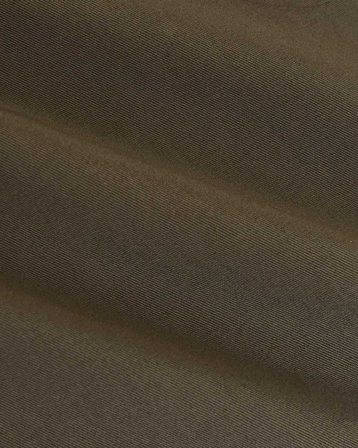 Military Green Coaches Jacket showing olive-green twill fabric's diagonal weave.