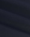 Navy Coaches Jacket's fine diagonal twill pattern, showcasing soft folds.