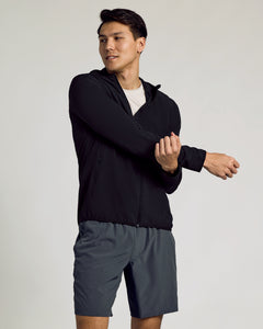 True ClassicBlack Active Shell Jacket worn by man stretching, showcasing slim fit.