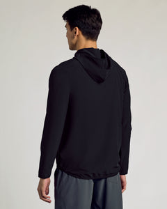 True ClassicMan wearing Black Active Shell Jacket, hood down, paired with dark gray pants.