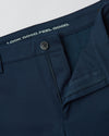 Navy Slim Comfort Knit Chino Pant with undone button and visible slogan.
