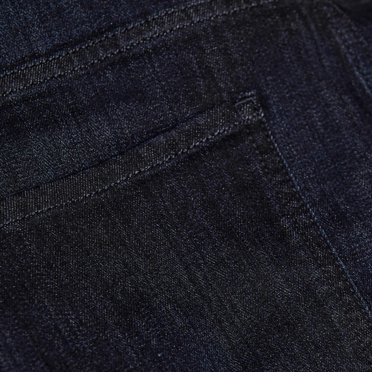 Close-up view of dark indigo denim fabric showing detailed stitching on the back pocket of the Indigo & Gray Straight Comfort Jeans 3-Pack men's basics.
