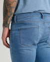 Medium Indigo Wash Straight Comfort Stretch Jeans with back pockets and belt loops.