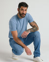 Man wearing Medium Indigo Wash Straight Comfort Stretch Jeans, showcasing comfort and style.