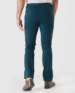True ClassicMan wearing Centurion Slim Twill Chino Pant, teal-blue, with brown sneakers.