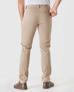 True ClassicBack view of Khaki Slim Twill Chino Pant with brown sneakers.