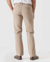Khaki Straight Twill Chino Pant with brown slip-on sneakers, rear view.