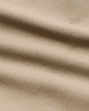 Khaki Slim Chino Pants 2.0, ultra-soft beige woven fabric close-up.