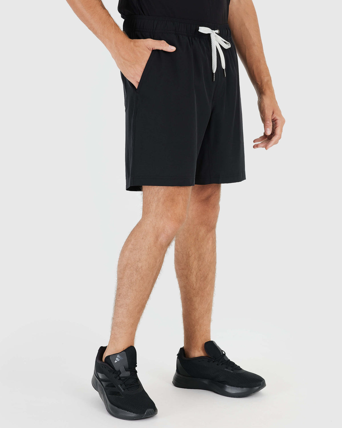 Black Active Quick Dry Shorts with Liner worn with black running shoes.