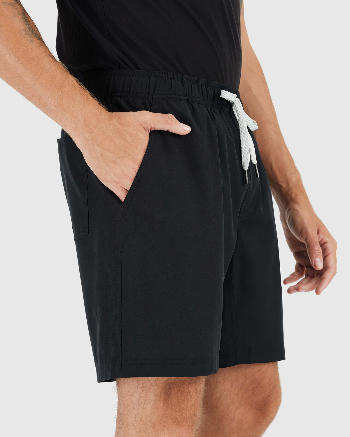 Man wearing Black Active Quick Dry Shorts with Liner featuring drawstring and pockets.
