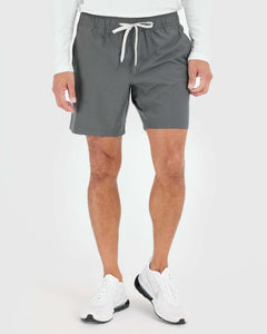 True ClassicMan wearing Carbon Active Quick Dry Shorts with white sneakers.