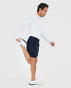 Man stretching in Navy Active Quick Dry Shorts with Liner.